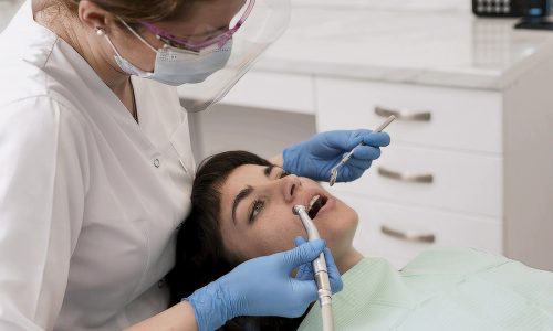 female-patient-having-procedure-done-dentist